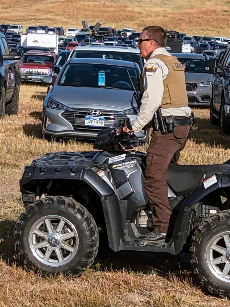 State Park Ranger supervises crowd at the Buffalo Roundup